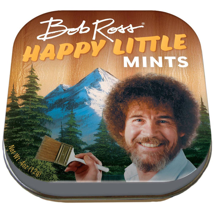 A tin of Bob Ross branded mints with an image of the artist Bob Ross smiling and holding a paintbrush, set against a backdrop of a mountain and trees.