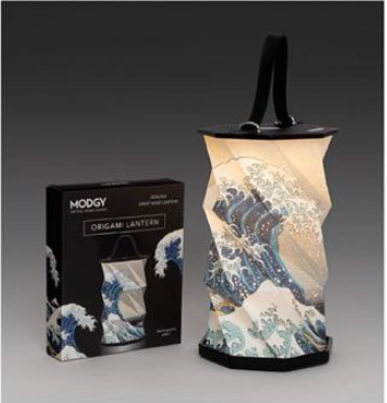 An origami lantern with a design resembling the Great Wave off Kanagawa, displayed next to its packaging.