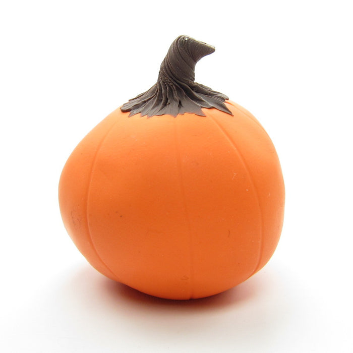 Orange polymer clay pumpkin with yellow face
