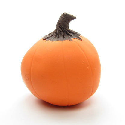 Orange polymer clay pumpkin with yellow face