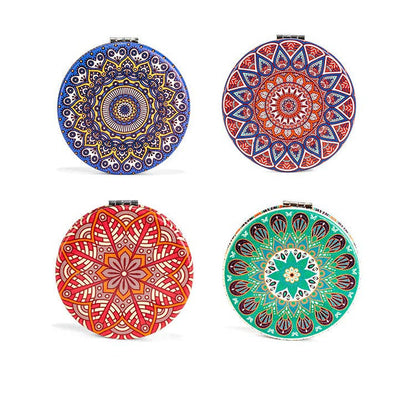 Four round decorative plates with colorful mandala patterns on a white background