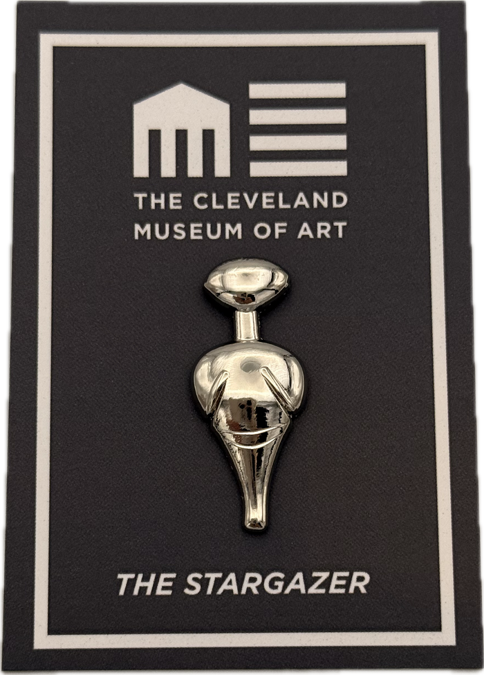 Metallic 'The Stargazer' sculpture Lapel Pin on a card with 'The Cleveland Museum of Art' branding.