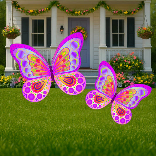Colorful butterfly yard art signs displayed on a lawn in front of a house with a decorated porch.